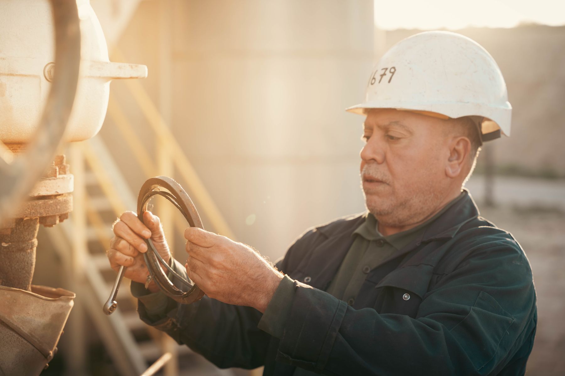 Engineer inspecting equipment on an industrial site