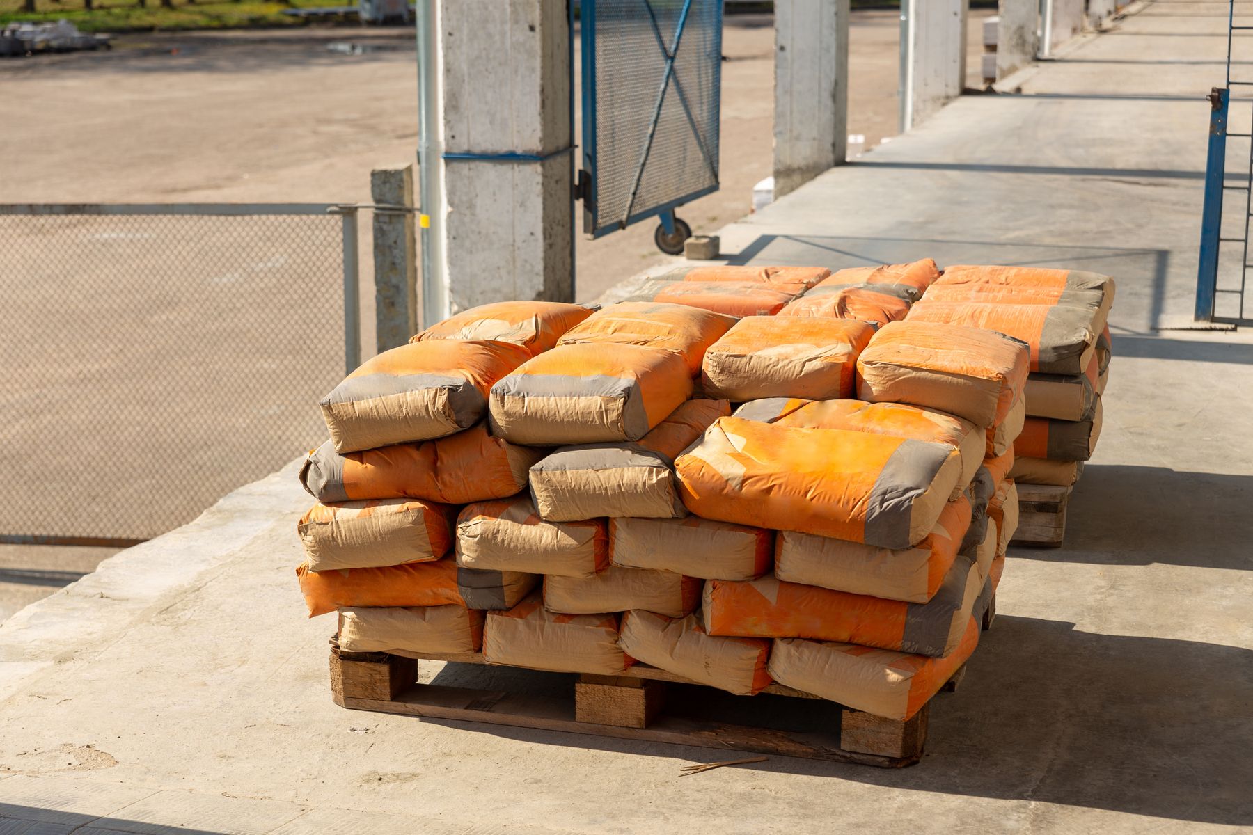 Palletized sacks of dry powder material